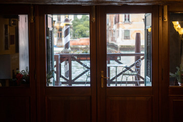 Caanal through a window, Venice Italy