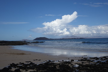 Cloads over Lobos Island viewed from the Natural park of  Corralejo in Fuerteventura,La Oliva,Canary Islands,Spain