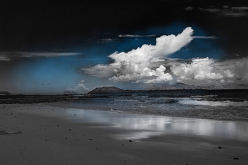Cloads over Lobos Island viewed from the Natural park of  Corralejo in Fuerteventura,La Oliva,Canary Islands,Spain