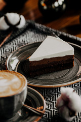 cup of coffee and cake on table