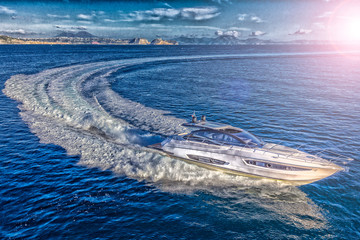 Obraz premium luxury motor yacht in navigation, aerial view