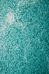 green or turquoise hammered metal background,abstract metalic texture, sheet of metal surface painted with hammer paint.