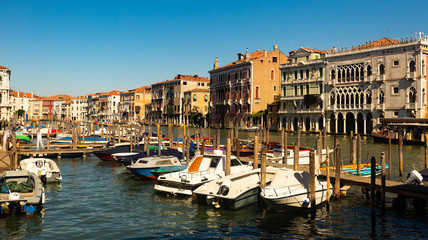 Fototapeta na wymiar Motor boats parking in Grand Canal in Venice