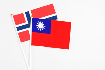 Taiwan and Bouvet Islands stick flags on white background. High quality fabric, miniature national flag. Peaceful global concept.White floor for copy space.