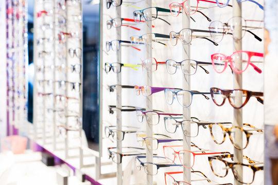 Glasses showcase in modern optic shop © JackF