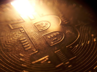 Bitcoin stack in blurry close-up shot with flames reflection on the background.