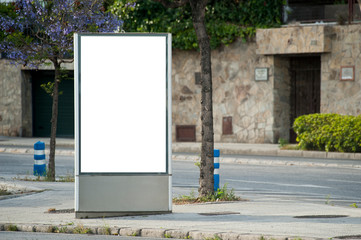 billboard with light in the city center with stone wall background