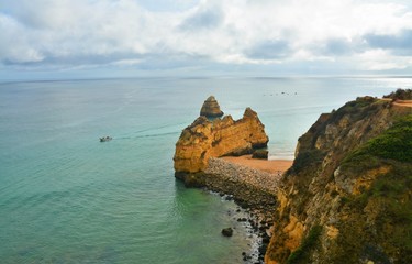 rocky beach in Lagos - Portugal on a cloudy day