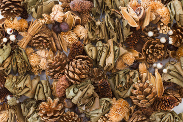 Vintage Christmas decoration. Golden Pine cones and dry leaf decoration. 