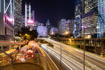 Fototapeta na wymiar Traffic light trails captured in the Central business district in Hong Kong island at night in Hongkong