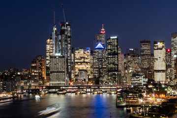 Fototapeta premium Twilight over the famous Circular Quay ferry terminal and the business district skyline in Sydney in Australia largest city