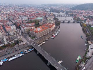 Obraz premium Prague bridges aerial view at autumn in twilight cloudy day, blue hour