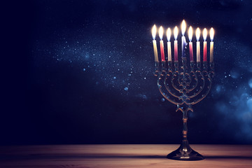 Religion image of jewish holiday Hanukkah background with menorah (traditional candelabra) and candles