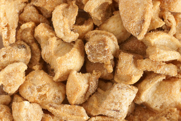 Pork scratchings deep fried pork rinds a popular snack