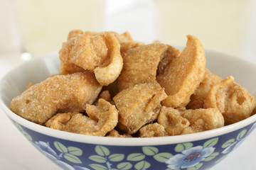 Pork scratchings deep fried pork rinds a popular snack