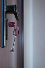 Key in the keyhole. Security guarantee concept. Close-up