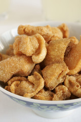 Pork scratchings deep fried pork rinds a popular snack