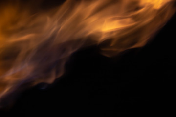 Soft blur flame from moving to the top with some blue flame on black background. For overlay effect