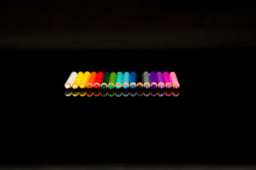 Color pencil on black background