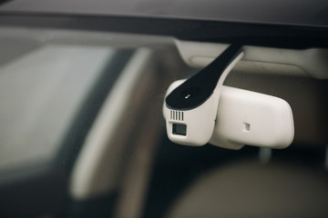 Rain and light sensor on the windshield of the car