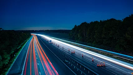 Aluminium Prints Highway at night Motorway fast traffic light trails at night