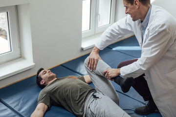 Fototapeta premium Patient Stretching His Leg