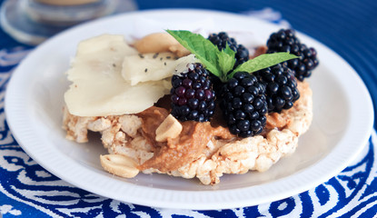 Snack with peanut butter, parmesan and fruit