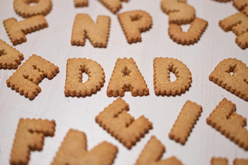 Father word made of gingerbread cookies. cookies alphabet