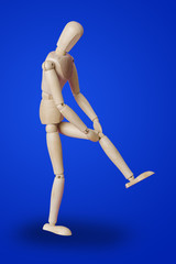 Wooden toy figure of patient - medical concept