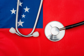 Flag of Samoa and stethoscope. The concept of medicine.