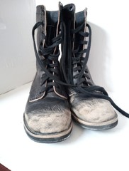 pair of old boots on white background