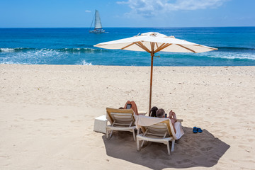 chairs and umbrella on tropical beach, Réunion Island 