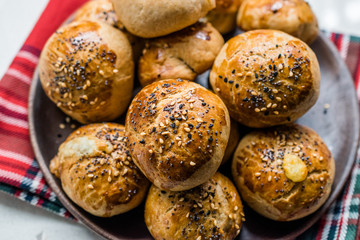 Homemade Turkish Pastries Pogaca with Black Cumin and Sesame Seeds.