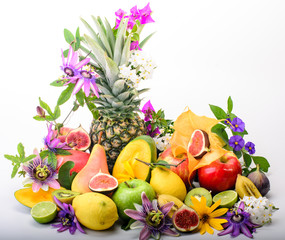 Enjoy your healthy breakfast: collection of various fruits with passion flowers on white background