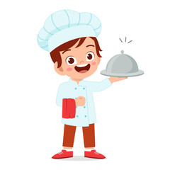 happy cute kid boy in chef costume