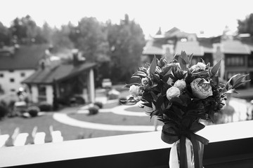monochrome photo of wedding bouquet and flowers decorations at wedding day