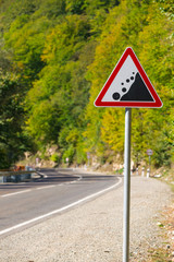 warning road sign - rockfall possible
