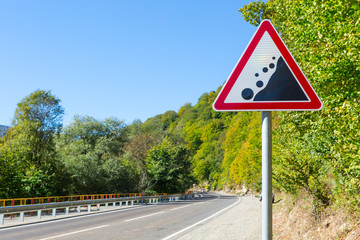 warning road sign - rockfall possible