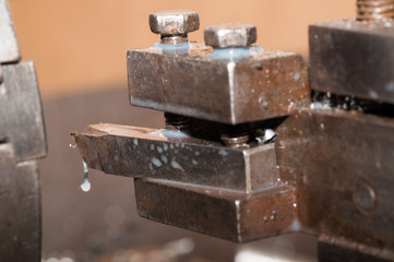 Metal processing by lathe machine. cutting tool at mechanical turning metal working