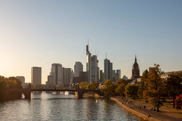 Visiting Frankfurt. View over the river Main to the city skyline. Skyline of Frankfurt am Main in the summer sunset, Germany. Frankfurt am Main, Germany. Cityscape image of Frankfurt am Main in sunset