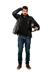 Full-length shot of Biker man frustrated and takes hands on head over isolated white background