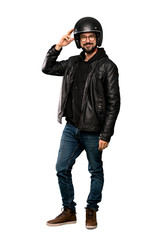 Full-length shot of Biker man with glasses and smiling over isolated white background