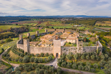 Fototapeta na wymiar aerial view to facade of medieval castle Monteriggioni in Tuscany in Italy from drone