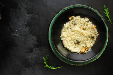 risotto mussels main course (delicious rice with seafood) menu concept. food background. top view. copy space