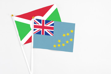 Tuvalu and Burundi stick flags on white background. High quality fabric, miniature national flag....