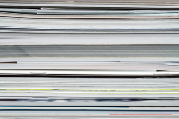 Background from stacked magazines, brochures, notebooks, catalogs