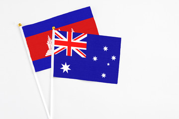 Australia and Cambodia stick flags on white background. High quality fabric, miniature national...