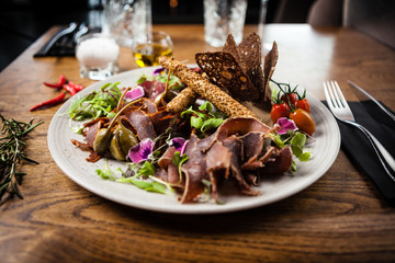 Meat platter for two served on a plate in restaurant