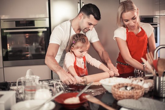 Beautiful Family Bake Christmas Cookies. Family Cooks In The Kitchen. Holidays. Christmas. New Year. Cozy.