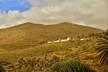  empty mysterious mountainous landscape from the center of the Canary Island Spanish Fuerteventura with a cloudy sky